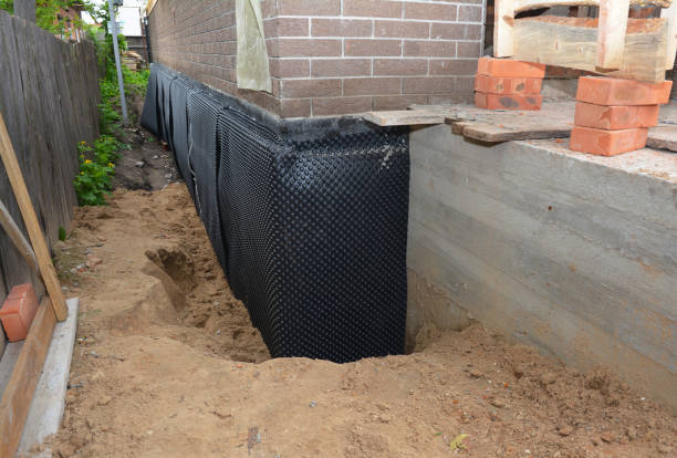 Happy homeowners after waterproofing job in Buck Creek
